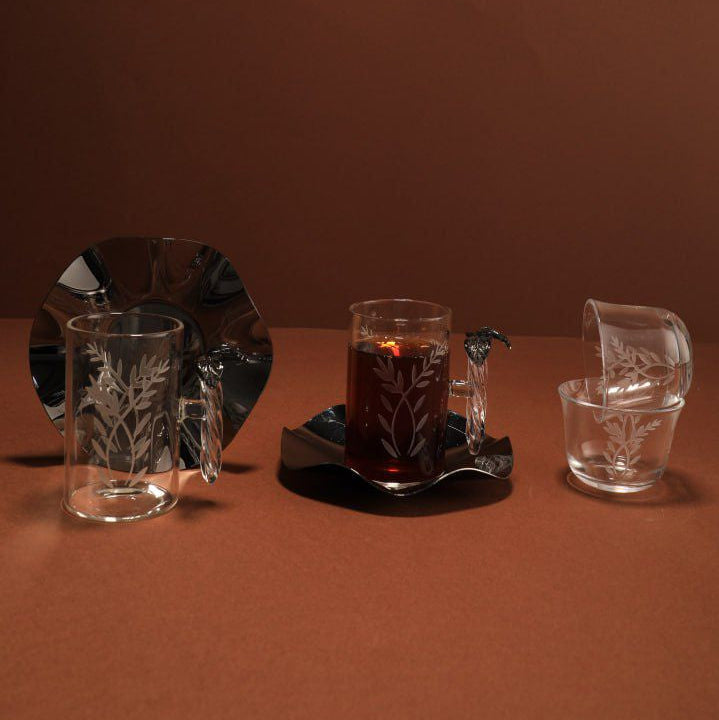 Set of crystal glasses on a brown surface with a dark background