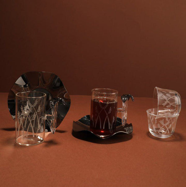 Set of glassware on a brown surface with a brown background