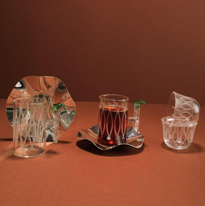 Set of crystal glasses on a brown surface with a plain background