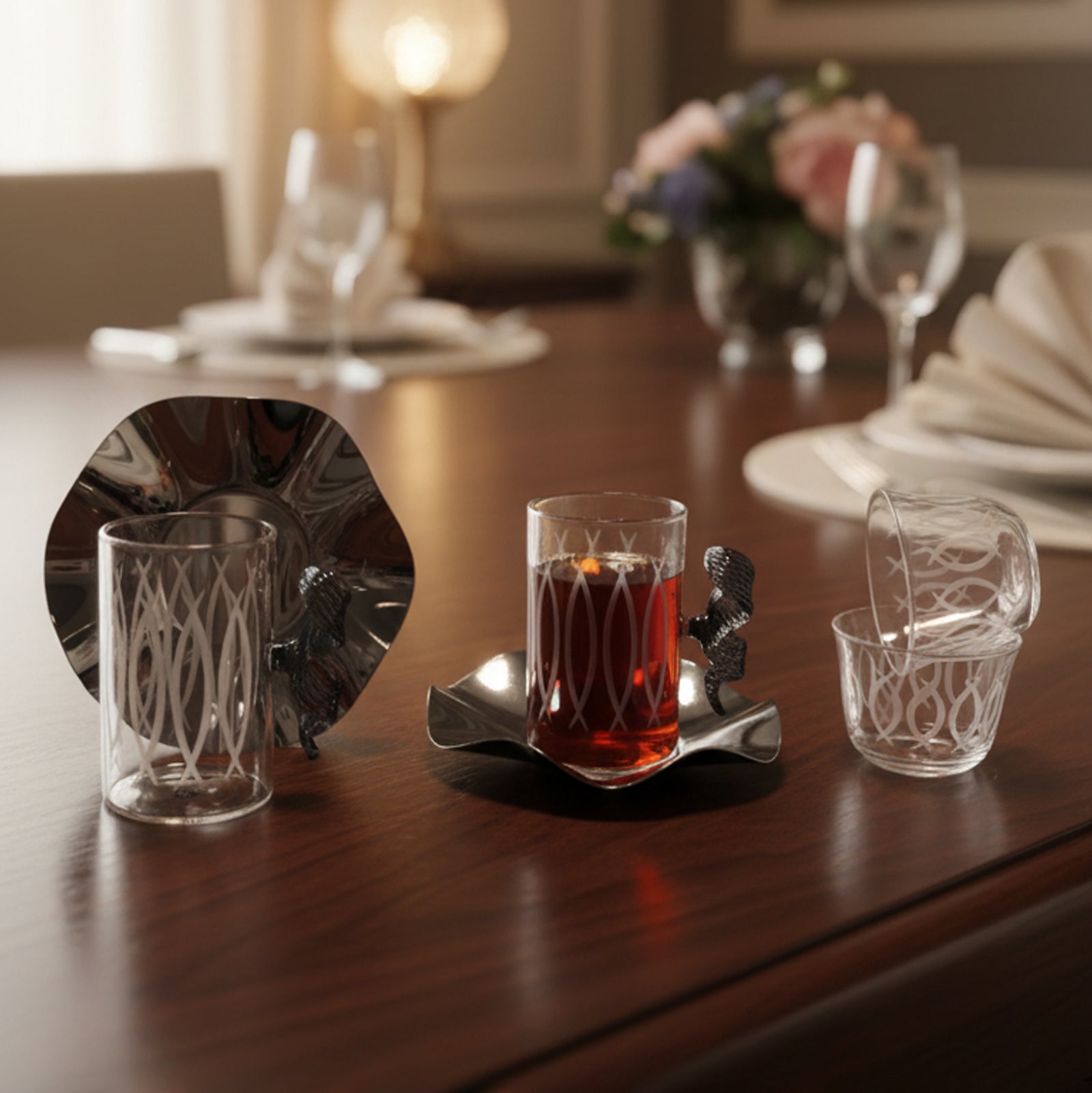 Glass with red liquid on a wooden table with decorative elements