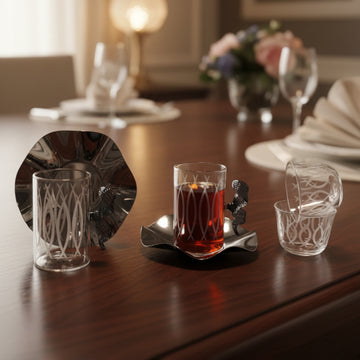 Glass with red liquid on a wooden table with decorative elements