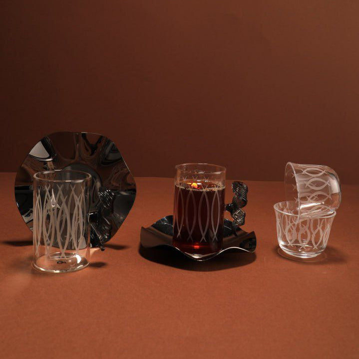 Set of glassware on a brown surface with a brown background
