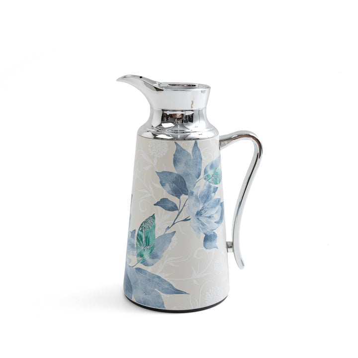 Decorative ceramic pitcher with floral design on a white background