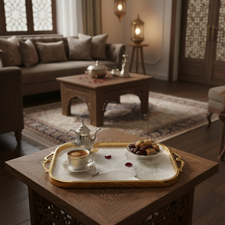Tray with tea set and snacks in a cozy living room setting