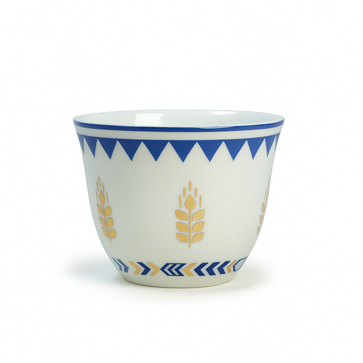 Ceramic cup with blue and yellow patterns on a white background
