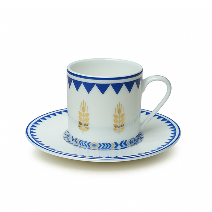 Ceramic cup and saucer with blue and white design on a white background