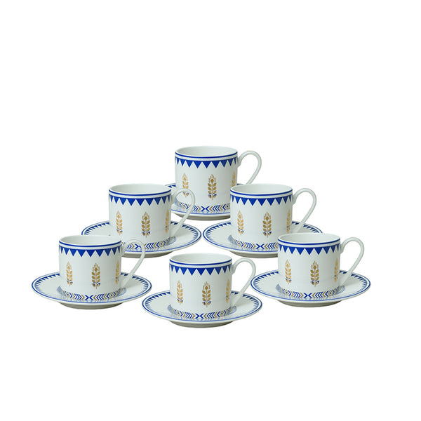 Set of ceramic cups and saucers with decorative patterns on a white background