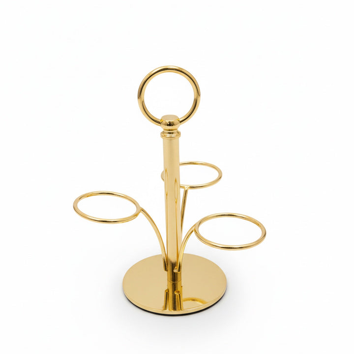 Gold metal ring holder on a white background