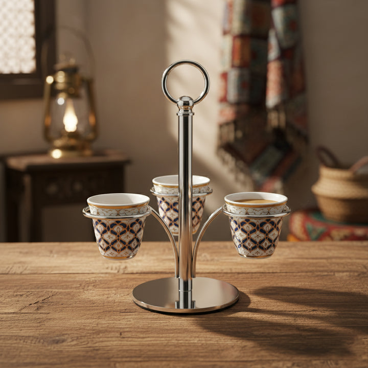 Three espresso cups on a metal stand with a warm, homey background.
