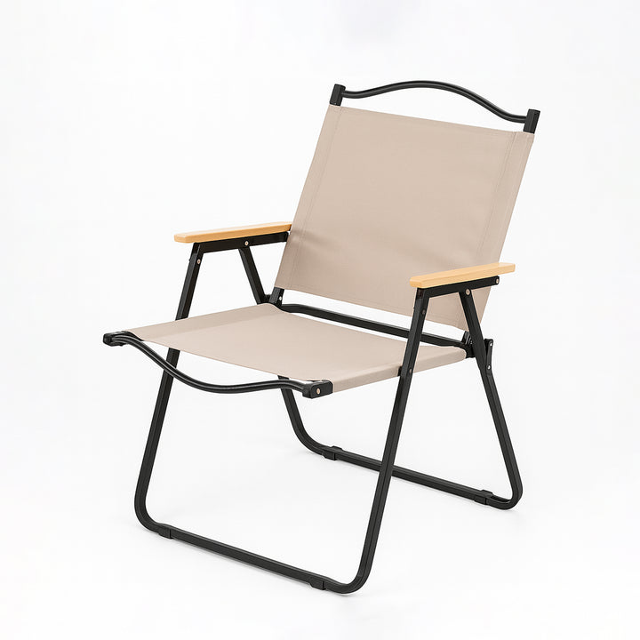 Beige folding chair with black frame on a white background