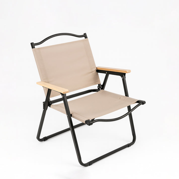 Beige folding chair with black frame on a white background