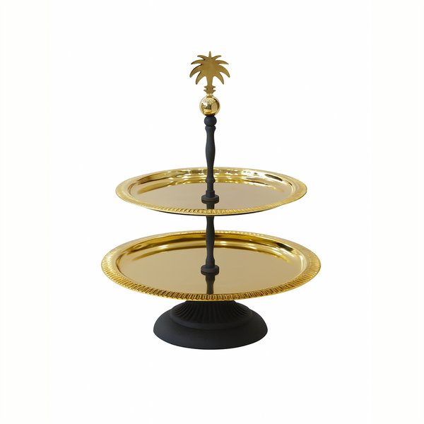 Two-tiered serving tray with gold trays and a black stand on a white background