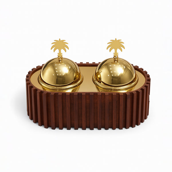 Decorative object with gold domes and palm tree sculptures on a brown base