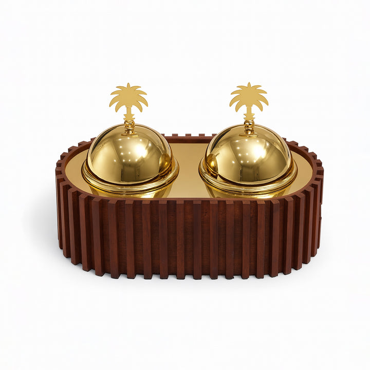 Decorative object with gold domes and palm tree sculptures on a brown base