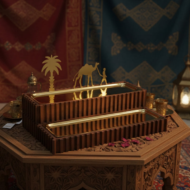 Decorative wooden box with intricate carvings and gold accents on a patterned fabric background.