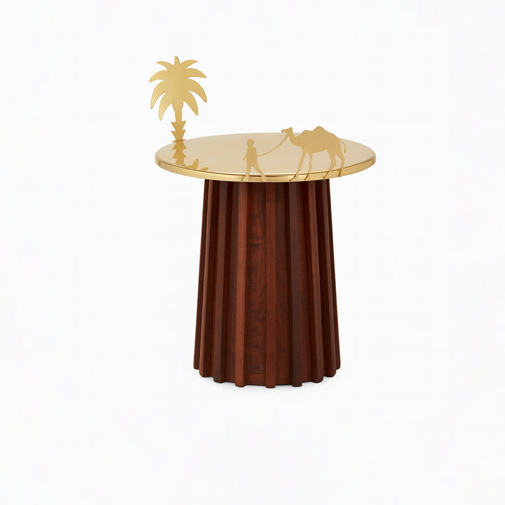 Decorative side table with gold leaf top and wooden base on a white background