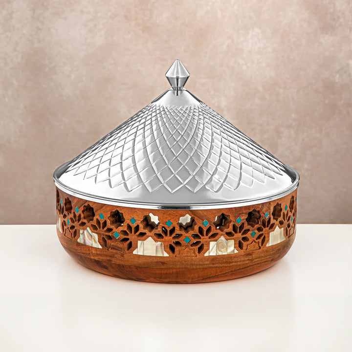 Decorative wooden box with a silver lid on a beige background