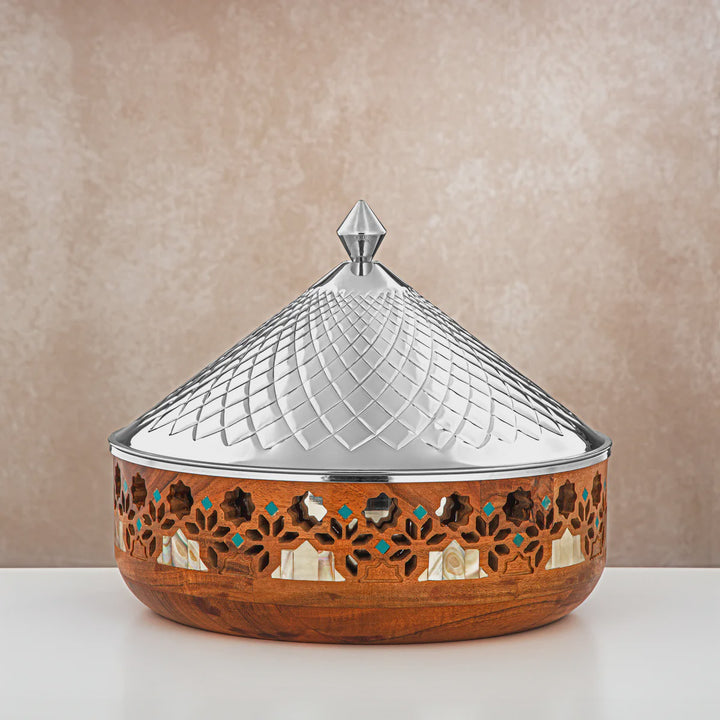 Decorative wooden box with a metallic lid on a beige background