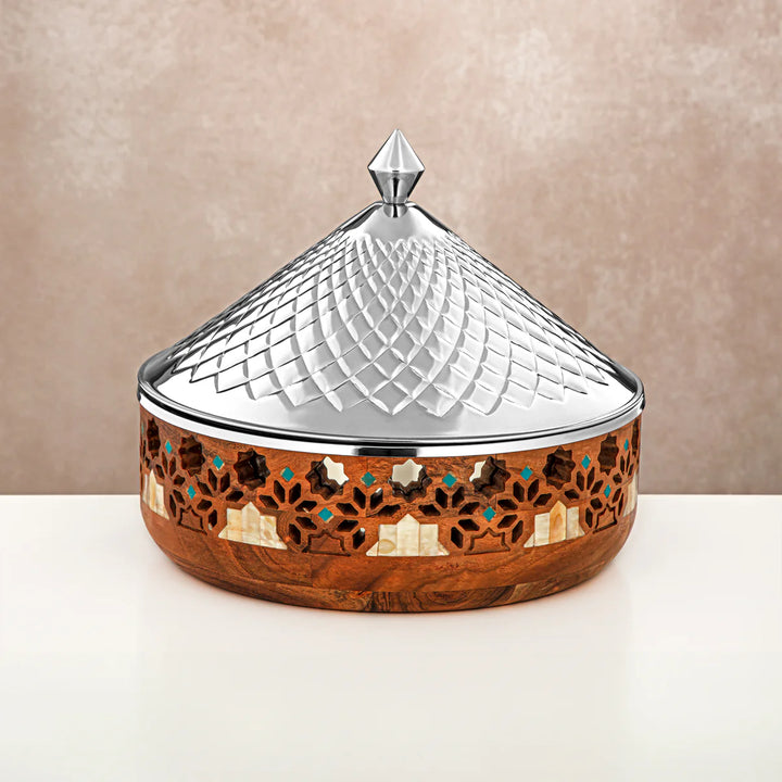 Decorative wooden box with a silver lid on a beige background