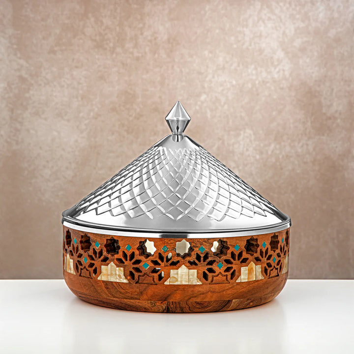 Decorative wooden box with a metallic lid on a beige background