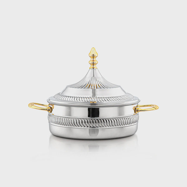 Silver pot with gold handles and decorative lid on a white background