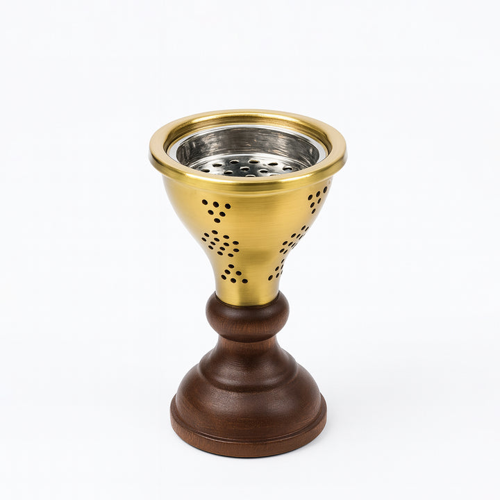 Decorative candle holder with gold top and brown base on a white background