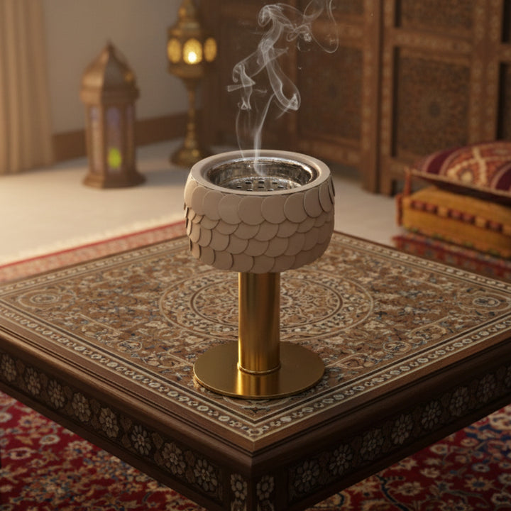 Decorative incense burner with smoke on a patterned rug