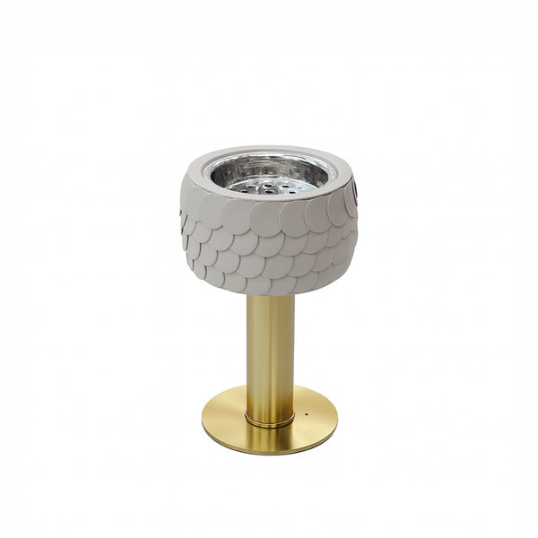 Decorative lamp with fish scale pattern and gold base on a white background