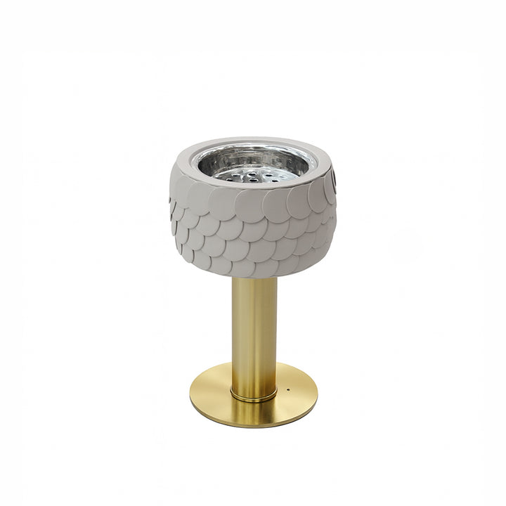 Decorative lamp with fish scale pattern and gold base on a white background