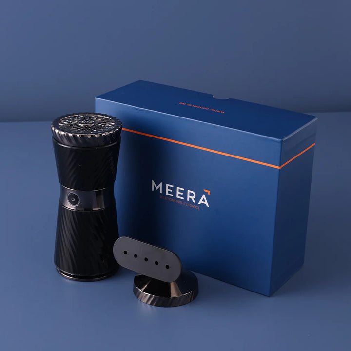 Black MEERA grooming device with packaging on a blue background