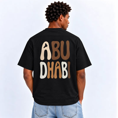 Men’s Abu Dhabi Graphic T-Shirt In Black With A Stylish Abu Dhabi Inspired Design, Short Sleeves, Crew Neck, And Comfortable Regular Fit At Siddiq Gifts.