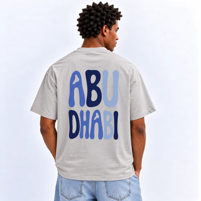 Men’s Abu Dhabi Graphic T-Shirt In Grey With A Stylish Abu Dhabi Inspired Design, Short Sleeves, Crew Neck, And Comfortable Regular Fit At Siddiq Gifts.