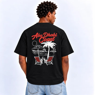 Men’s AD Coast Graphic T-Shirt In Black With A Stylish AD Coast Inspired Design, Short Sleeves, Crew Neck, And Comfortable Regular Fit At Siddiq Gifts.
