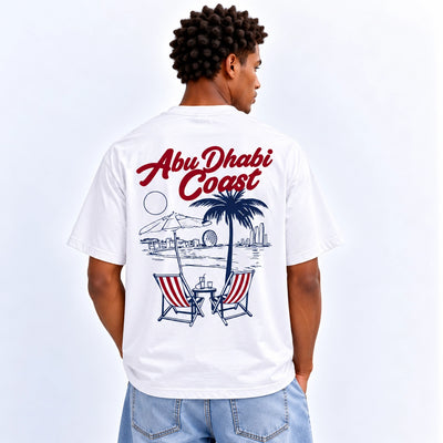 Men’s AD Coast Graphic T-Shirt In White With A Stylish AD Coast Inspired Design, Short Sleeves, Crew Neck, And Comfortable Regular Fit At Siddiq Gifts.