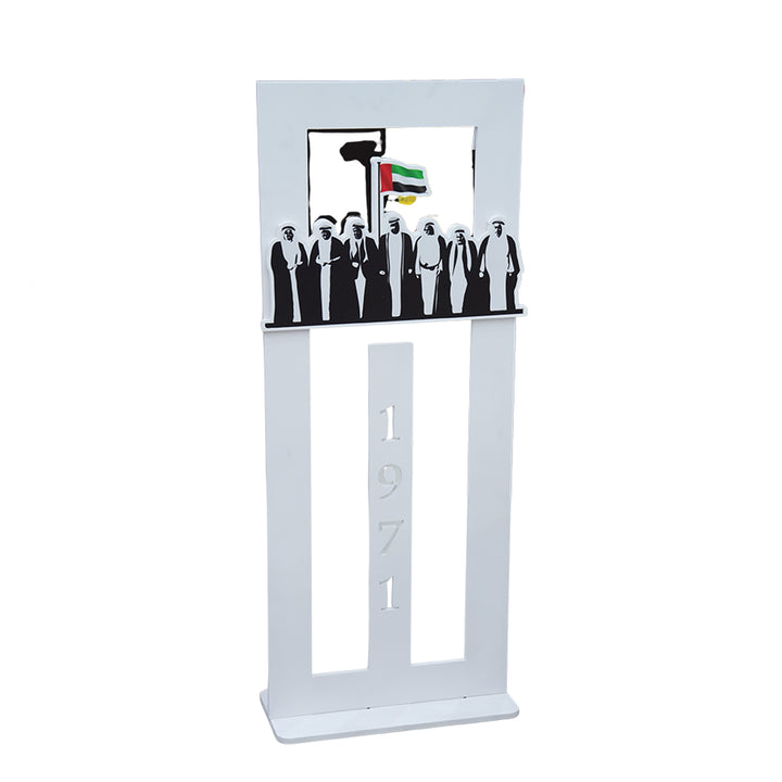 Decorative stand with silhouettes of people and a flag design on a white background