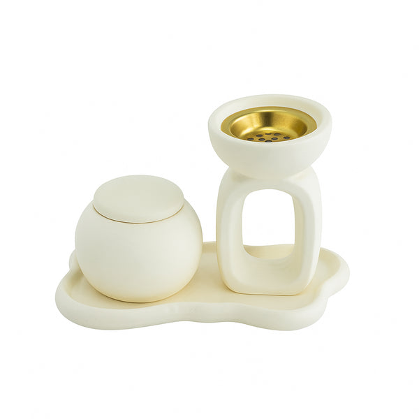 White ceramic tea set with a teapot, teacup, and saucer on a white background