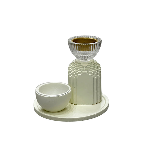 Ceramic candle holder and bowl set on a white background