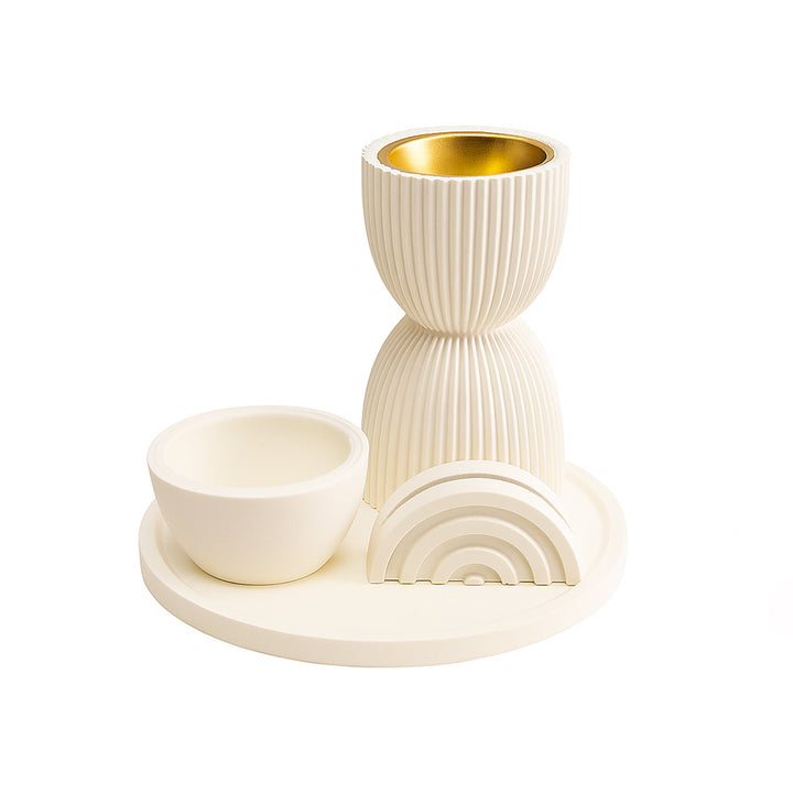 Decorative ceramic set with bowl, cup, and rainbow design on a white background