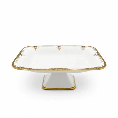 Elegant White Rectangular Ceramic Serving Bowl With A Raised Stand, Beautiful Gold Design, And Refined Gold Trim, Measuring 30 × 21 × 10 Cm And Ideal For Presenting Fruits, Sweets, Chocolates, Dates, Nuts, And Snacks At Siddiq Gifts.