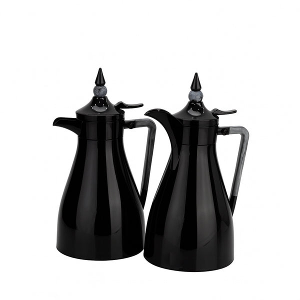Two black coffee pots with spouts on a white background