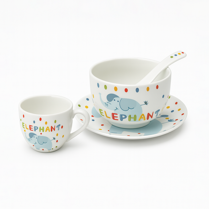 Children's ceramic cup, saucer, and spoon set with elephant design on a white background