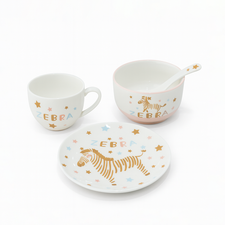 Children's ceramic tableware set with zebra design on a white background
