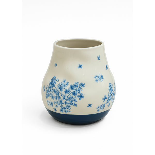 Ceramic vase with blue floral patterns on a white background