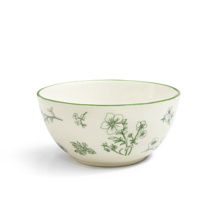Ceramic bowl with green floral patterns on a white background