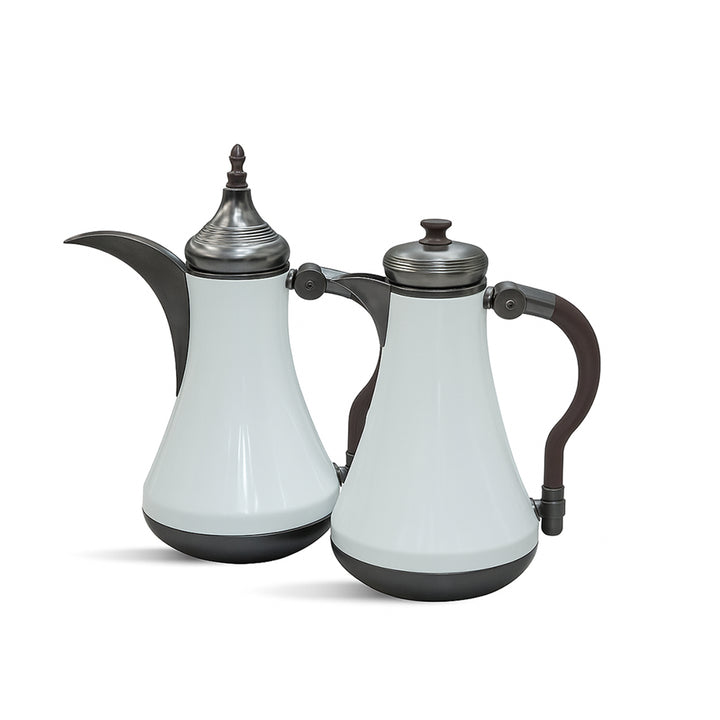 Two white ceramic teapots with black handles and lids on a white background
