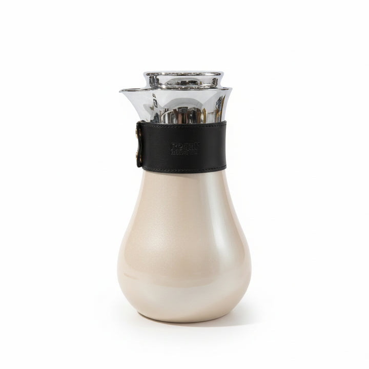 White ceramic carafe with black leather strap on a white background