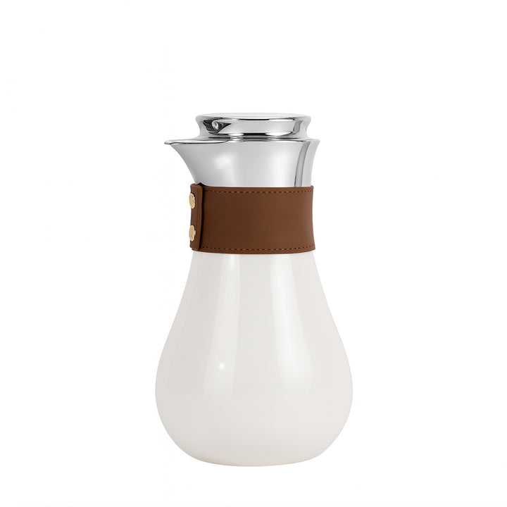 White carafe with a brown leather strap on a white background