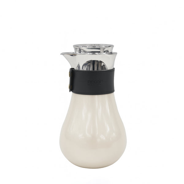 Clear glass carafe with a black band and white base on a white background
