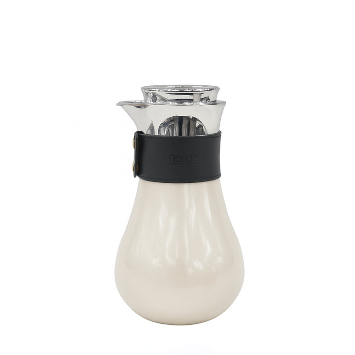 Clear glass carafe with a black band and white base on a white background