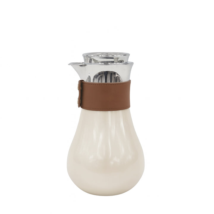 White carafe with brown leather strap on a white background